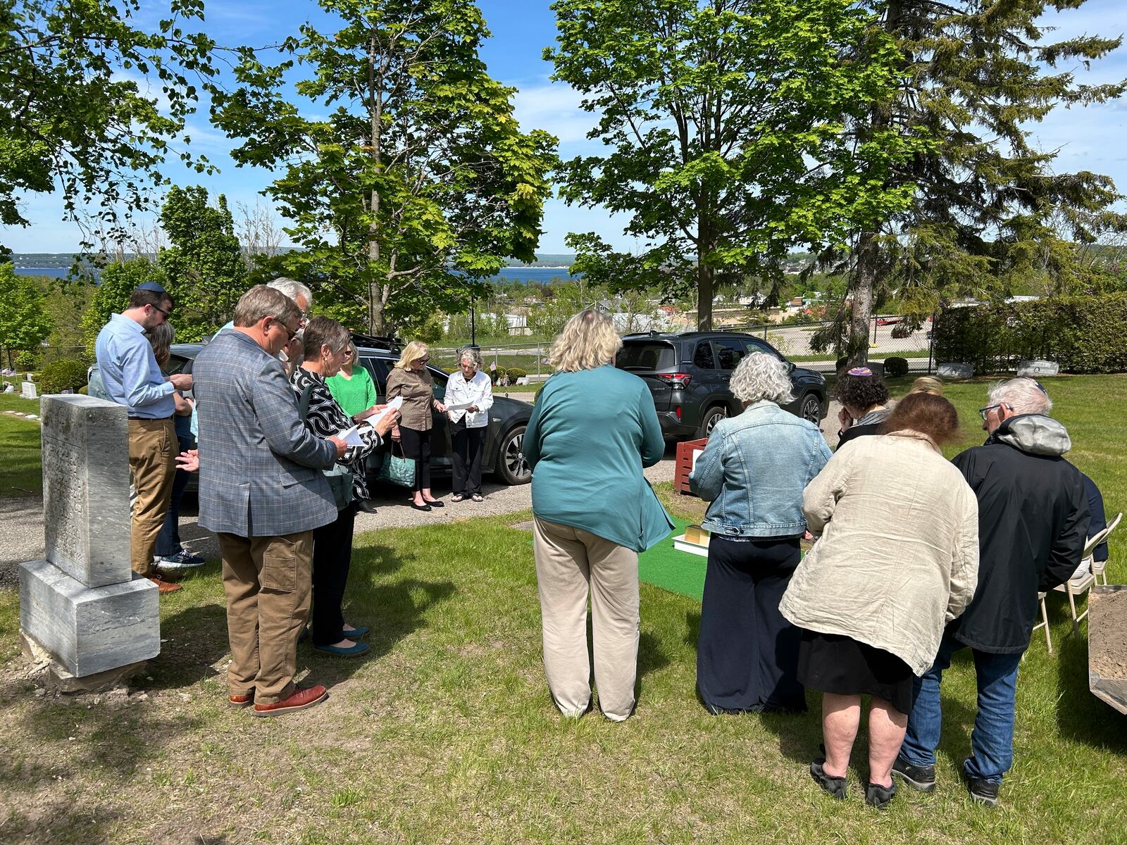 People gather at Greenwood Cemetery for the burial of Larry Rubin, former executive secretary of the Mackinac Bridge Authority, in Petoskey, Mich., Wednesday May 28, 2025. (Daniel Zivian via AP)