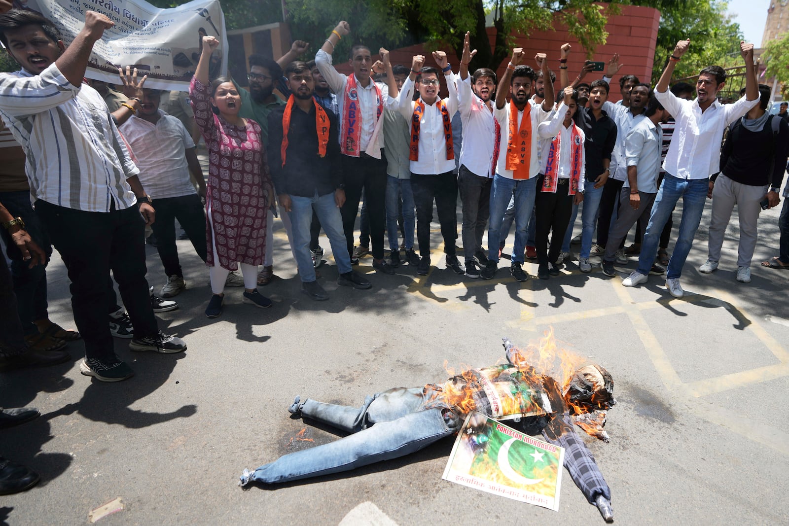 Supporters of Akhil Bharatiya Vidhyarthi Parishad, or All India Students' Council burn an effigy of terrorism and shouts slogans during a protest against the killing of tourists by militants near Pahalgam in Indian controlled Kashmir, in Ahmedabad, India, Thursday, April 24, 2025. (AP Photo/Ajit Solanki)
