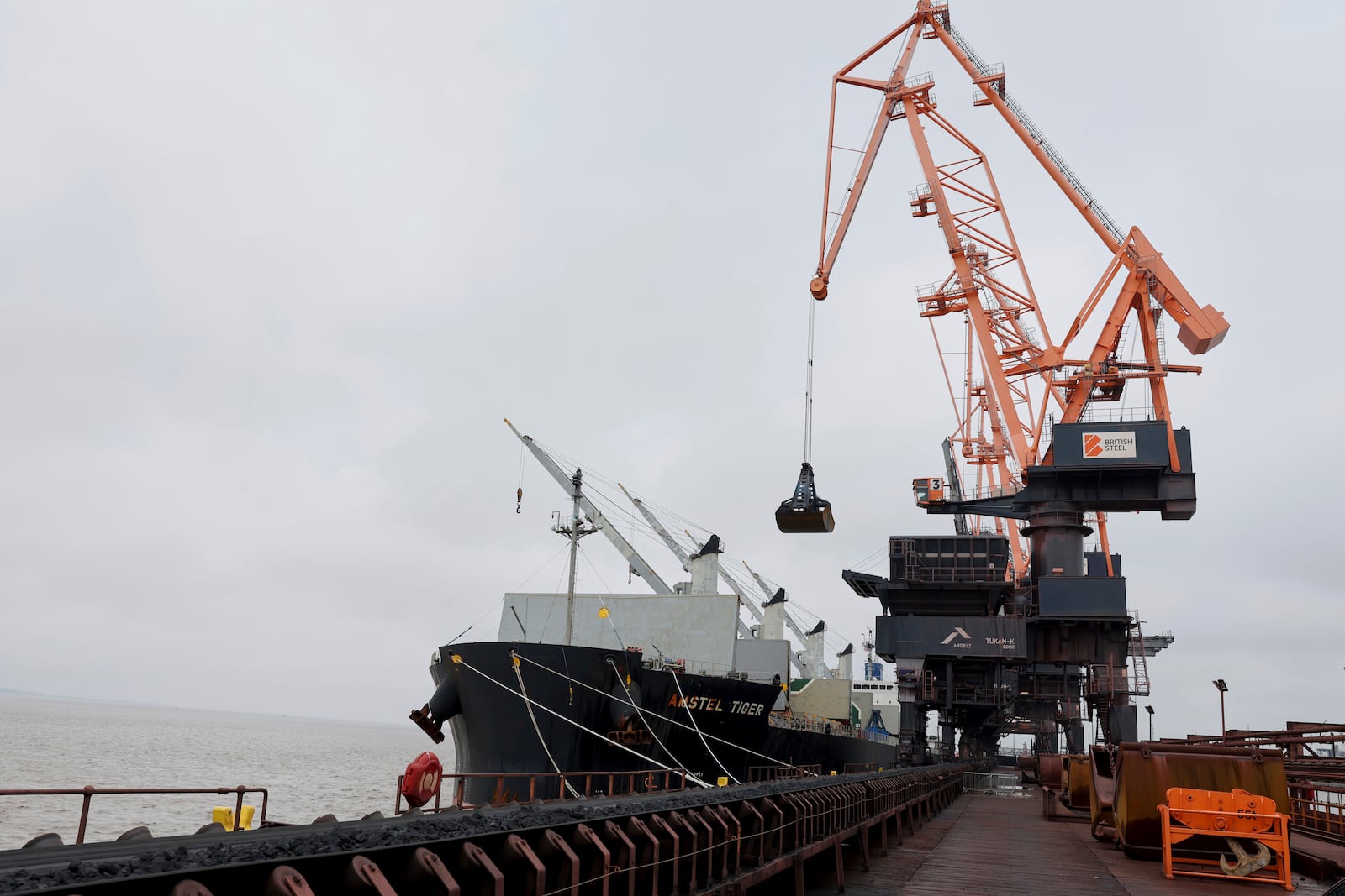 Coking coal is unloaded at Immingham Port, northern England, Tuesday, April 15, 2025. (Darren Staples/Pool Photo via AP)
