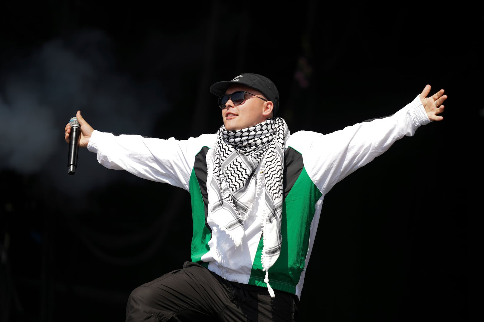 Liam Og of the hip hop trio Kneecap performs during the Glastonbury Festival in Worthy Farm, Somerset, England, Saturday, June 28, 2025. (Scott A Garfitt/Invision/AP)