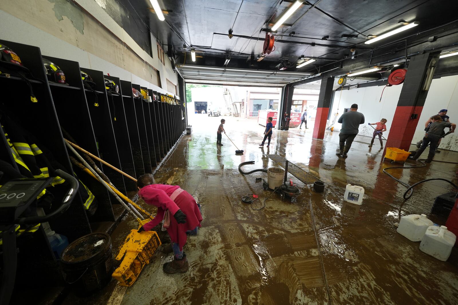 Clean up continues inside the fire station after flooding on Wednesday, May 14, 2025 in Westernport, Md. (AP Photo/Gene J. Puskar)