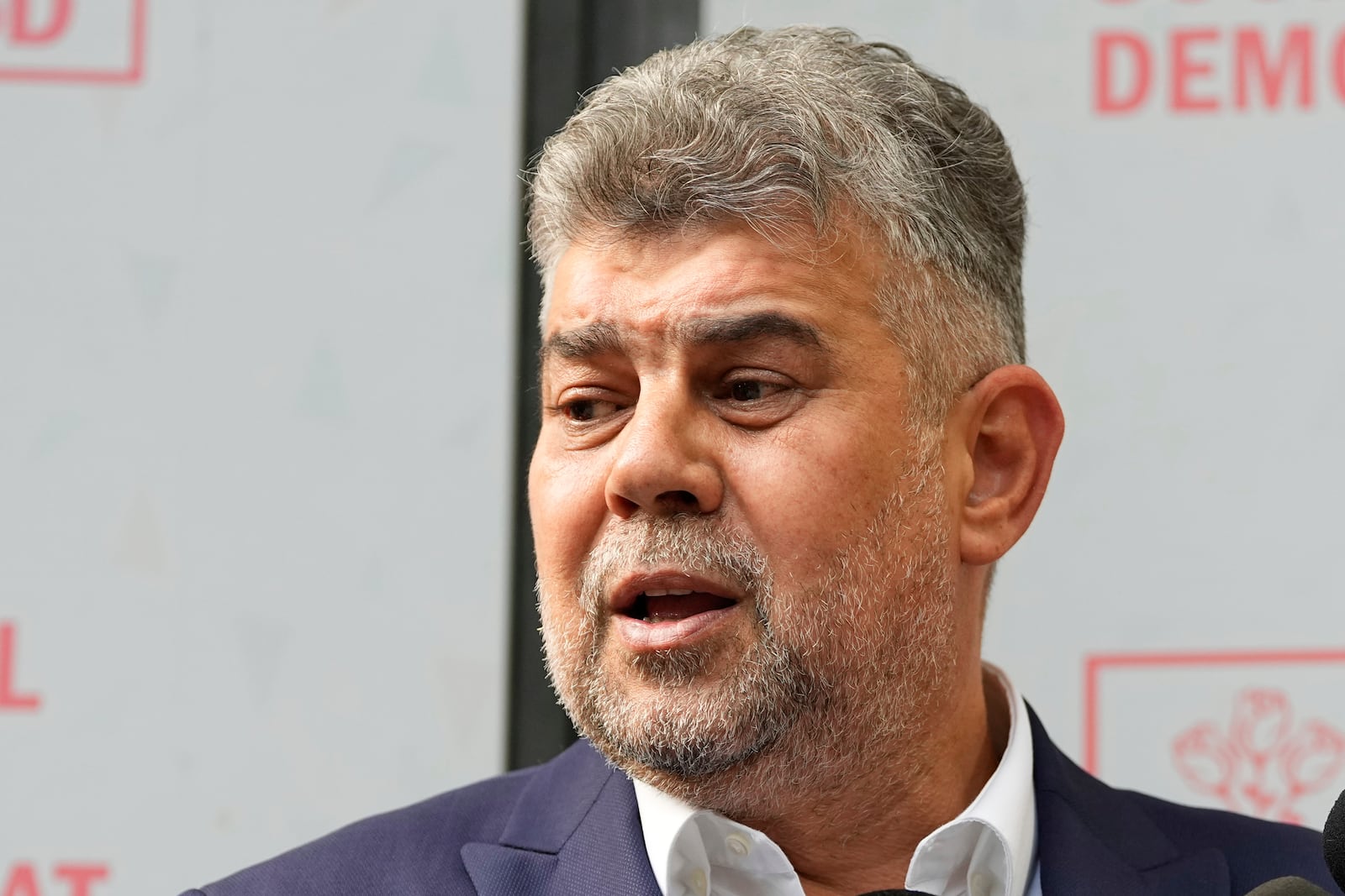 Romanian Prime Minister Marcel Ciolacu speaks to media at the PSD headquarters, in Bucharest, Romania, Monday, May 5, 2025, the day after the governing coalition's candidate failed to advance to the runoff in the presidential election rerun. (AP Photo/Andreea Alexandru)