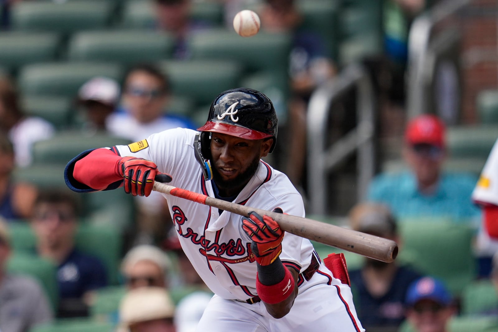 Atlanta Braves'Jurickson Profar (7) bunts into the glove of New York Yankees second baseman Jorbit Vivas (90) in the third inning of a baseball game, Sunday, July 20, 2025, in Atlanta. (AP Photo/Mike Stewart)