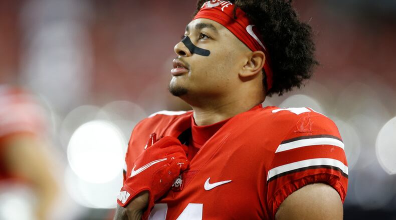 FILE - Ohio State quarterback C.J. Stroud plays against Penn State during an NCAA college football game, Oct. 30, 2021, in Columbus, Ohio. A Buckeyes attack that led the nation with 561 yards and nearly 46 points per game returns quarterback C.J. Stroud, leading receiver Smith-Njigba, 1,200-yard rusher TreVeyon Henderson and an experienced offensive line anchored by 6-foot-8, 360-pound right tackle Dawand Jones. (AP Photo/Jay LaPrete, File)