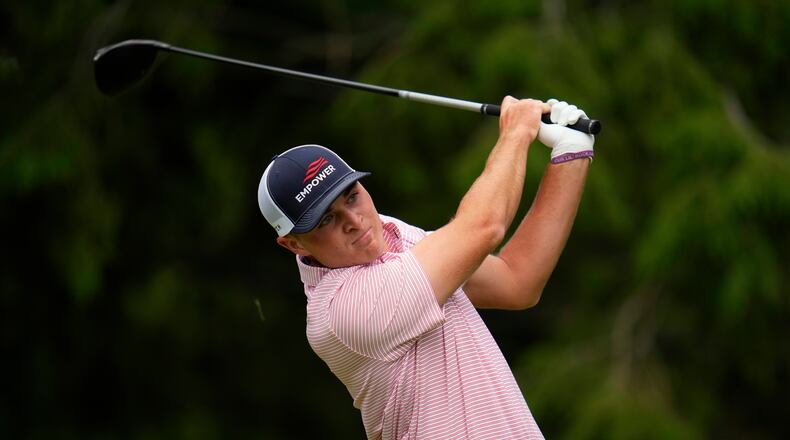 Austin Greaser watches his shot on the 17th hole during the first round of the U.S. Open golf tournament at The Country Club, Thursday, June 16, 2022, in Brookline, Mass. (AP Photo/Julio Cortez)