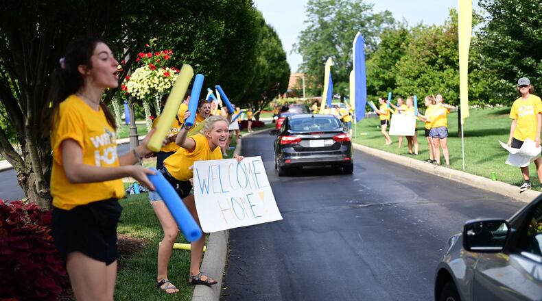 The annual tradition of Cedarville University's upperclassmen lining the main entrance to campus as first-time freshmen arrive to move into their residence halls is a Getting Started highlight. Photo by Scott Huck/Contributed