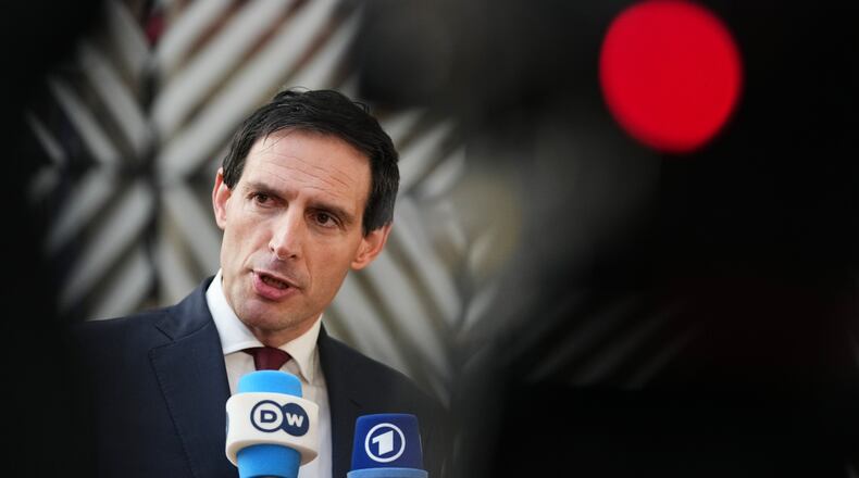 European Commissioner for Climate, Net-Zero and Clean Growth Wopke Hoekstra speaks with the media as he arrives for a meeting of EU Environment ministers at the European Council building in Brussels, Belgium, Tuesday, Nov. 4, 2025. (AP Photo/Virginia Mayo)