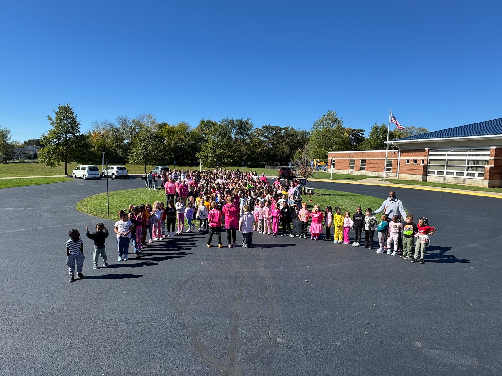 Lagonda Elementary students and staff held a walk around the school building in honor of Breast Cancer Awareness Month and to show support for first grade teacher Laurie Hammontree, who is celebrating five years of being cancer-free. Contributed