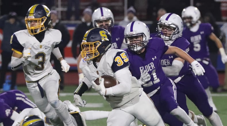 Springfield’s Jeff Tolliver runs the ball against Elder during a Division I state semifinal on Nov. 29, 2019, at Piqua. Bill Lackey/STAFF