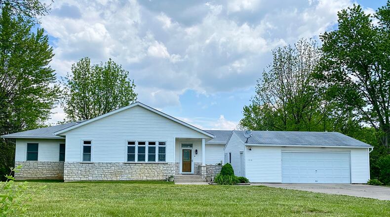The 3-bedroom ranch with about 2,300 sq. ft. of living space features a half stone wrap façade and vinyl siding. A 2-car, detached garage is also in the front, and there are two exterior doors off the front porch. The home includes a finished, full basement. CONTRIBUTED PHOTO