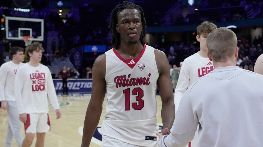 Miami (Ohio) forward Antwone Woolfolk (13) was off the court after Miami (Ohio) was defeated by Massachusetts in a basketball game in the quarterfinals of the Mid-American Conference tournament, Thursday, March 12, 2026, in Cleveland. (AP Photo/Sue Ogrocki)