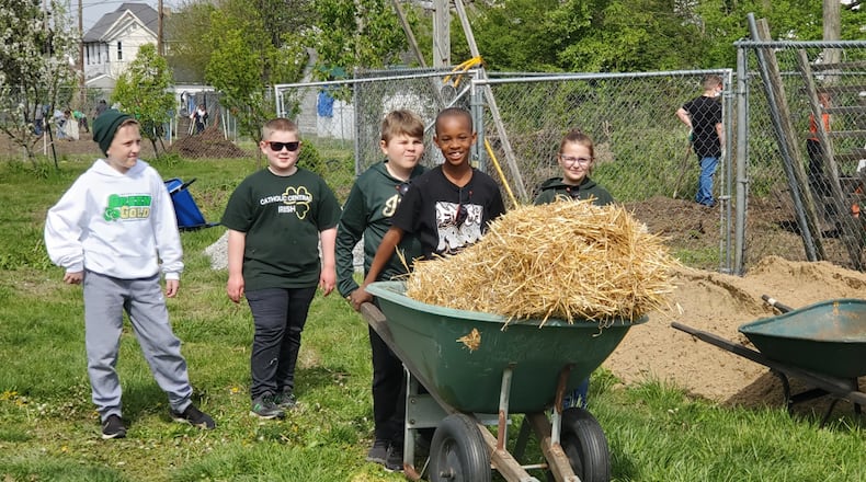 Community Health Foundation (CHF) supports the community with outreach funding and community events. A foundation HEAL grant helps fund the visioning garden at the Promise Neighborhood, which collaborated with others such as Catholic Central and the Springfield Museum of Art. Here, Catholic Central elementary students performed a service day at the garden and provided information on summer garden camps and activities. Contributed