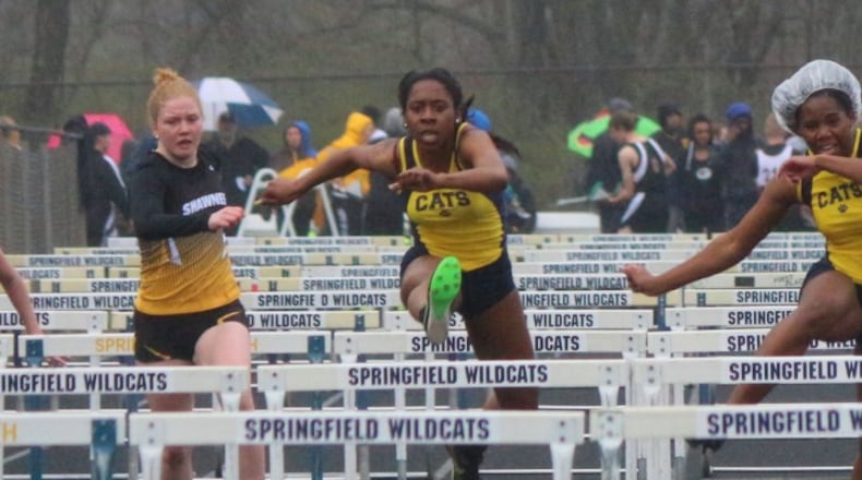 Springfield senior Tiffany Moss (middle), the defending Clark County 100-meter hurdles champion, set a personal best of 15.68 seconds in the hurdles at the Doug Adams Invitational in Xenia on Friday. Greg Billing / Contributed
