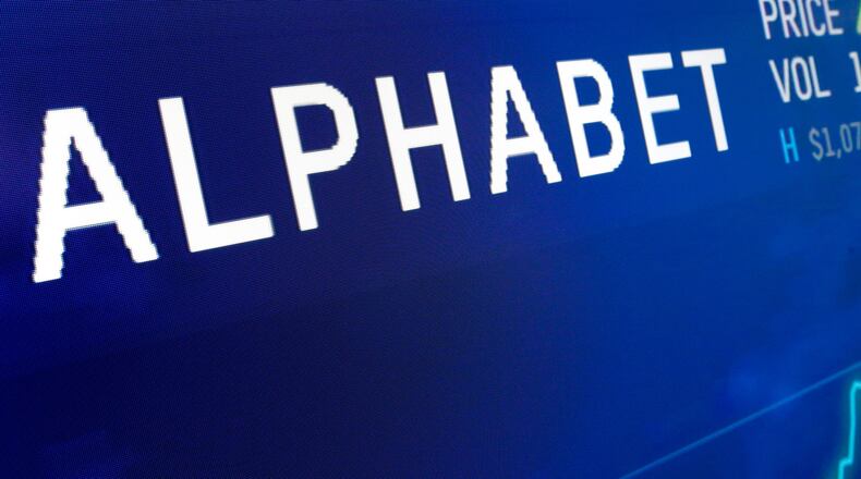 FILE - The logo for Alphabet appears on a screen at the Nasdaq MarketSite in New York, Feb. 14, 2018. (AP Photo/Richard Drew, File)