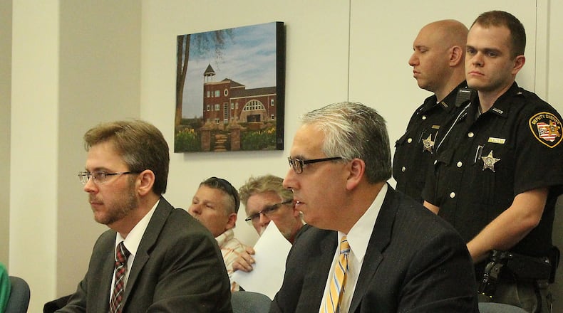 Champaign County Prosecutor, Kevin Talebi (right) and Assistant Prosecutor Benjamin Hoskinson listen to Juvenile Court Judge Lori Reisinger in a hearing involving murder charges against 14 year old Donovan Nicholas. JEFF GUERINI/STAFF