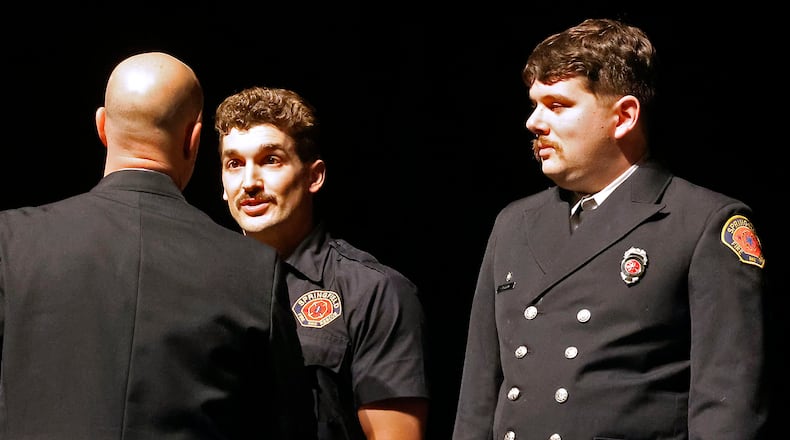 Springfield Firefighters Aaron Lopez, left, and Robert Bloom are awarded the fire division's highest honor, the Medal of Valor, Friday, Jan. 5, 2024 for risking their lives to save a child from a townhouse that exploded last year. The awards were part of the Clark State College and City of Springfield Fire Division's Fire Academy Graduation and Awards Ceremony. BILL LACKEY/STAFF