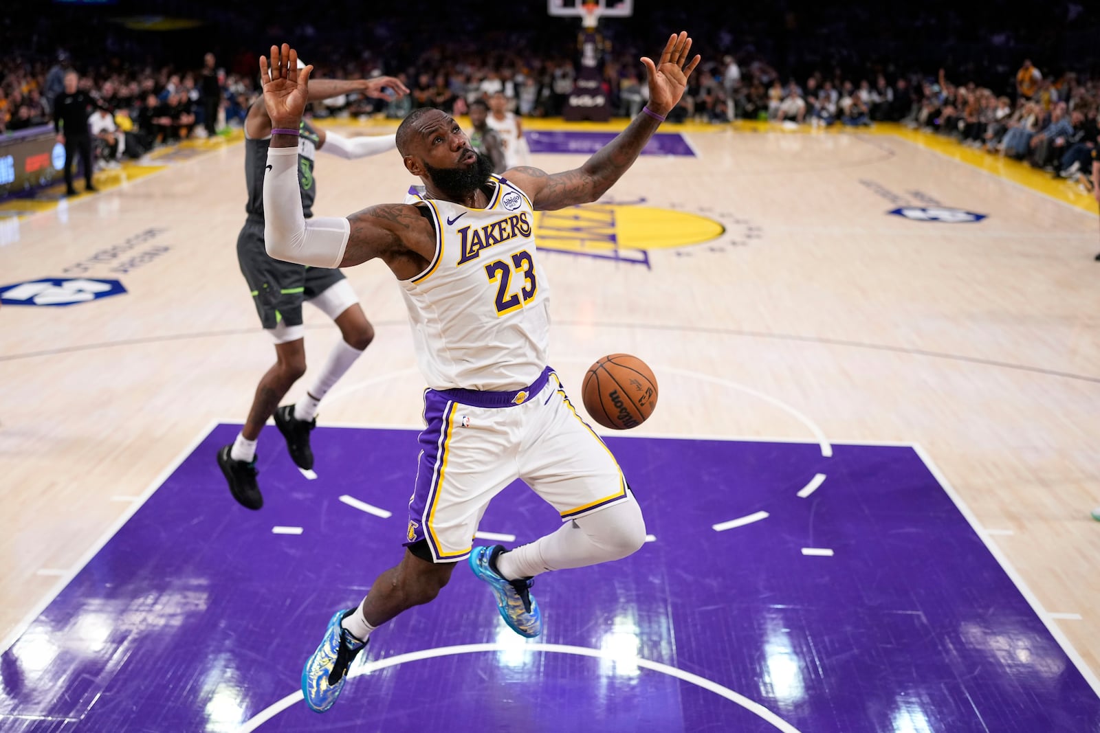 Los Angeles Lakers forward LeBron James dunks during the second half in Game 1 of an NBA first-round playoff series against the Minnesota Timberwolves, Saturday, April 19, 2025, in Los Angeles. (AP Photo/Mark J. Terrill)