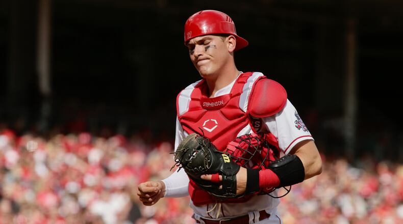 Reds catcher Tyler Stephenson reacts to a play during a game against the Guardians on Opening Day on Tuesday, April 12, 2022, at Great American Ball Park in Cincinnati. David Jablonski/Staff