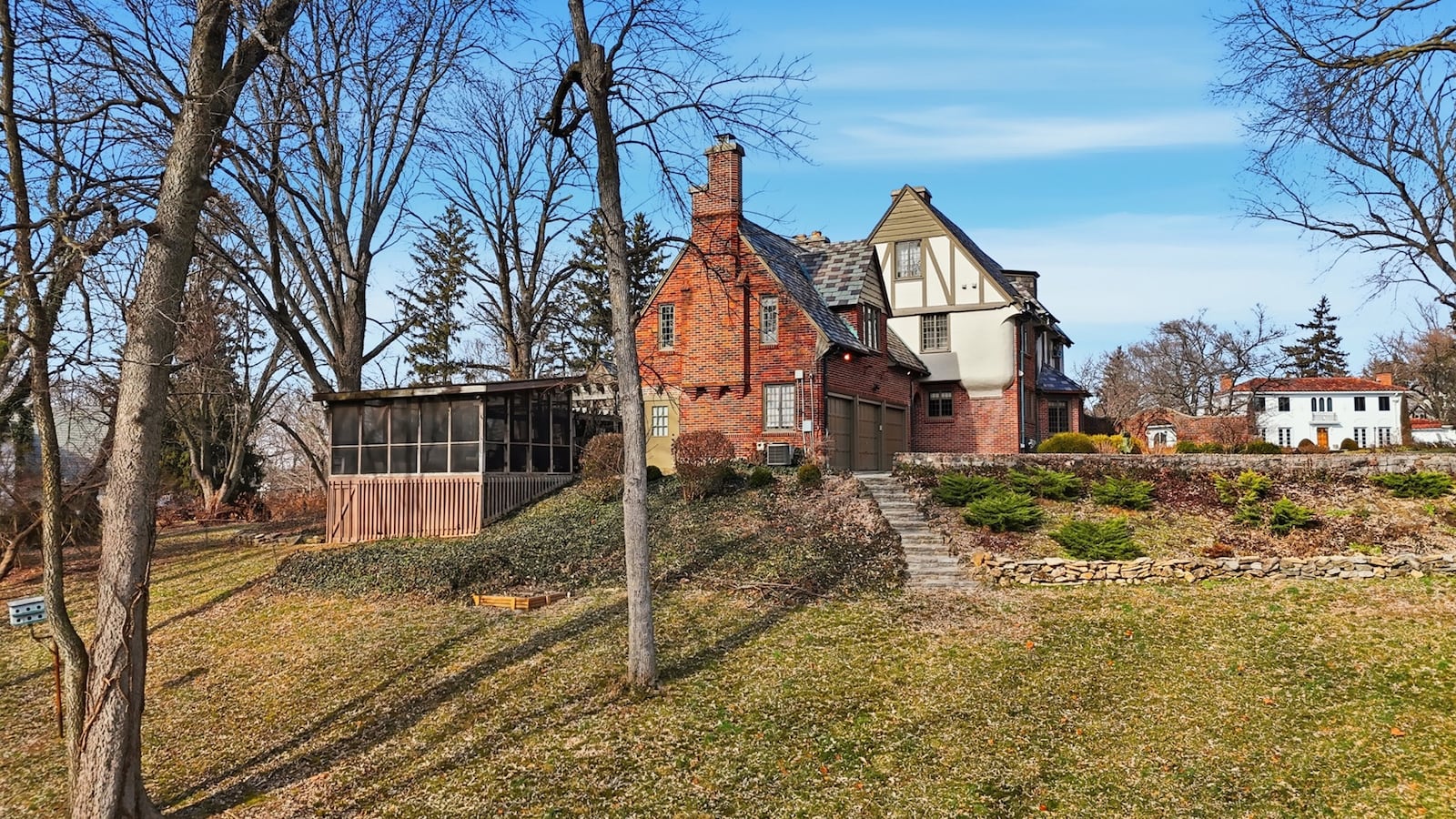 The home has a three car attached garage, a circular driveway and steps leading down into the heavily landscaped yard. CONTRIBUTED