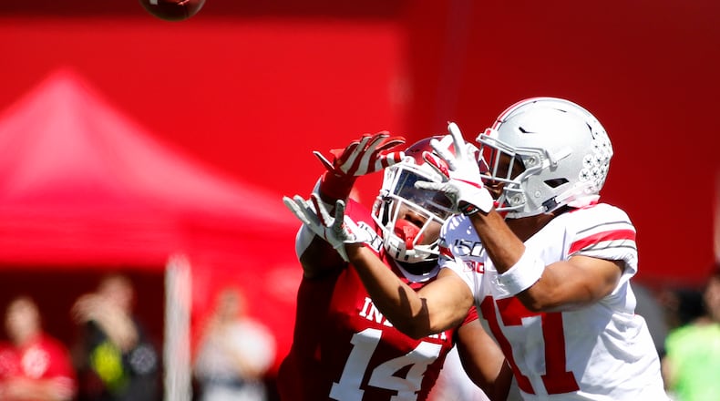 BLOOMINGTON, INDIANA - SEPTEMBER 14: Chris Olave #17 of the Ohio State Buckeyes attempts to catch a ball while being defended by Andre Brown Jr. #14 of the Indiana Hoosiers during the second quarter at Memorial Stadium on September 14, 2019 in Bloomington, Indiana. (Photo by Justin Casterline/Getty Images)