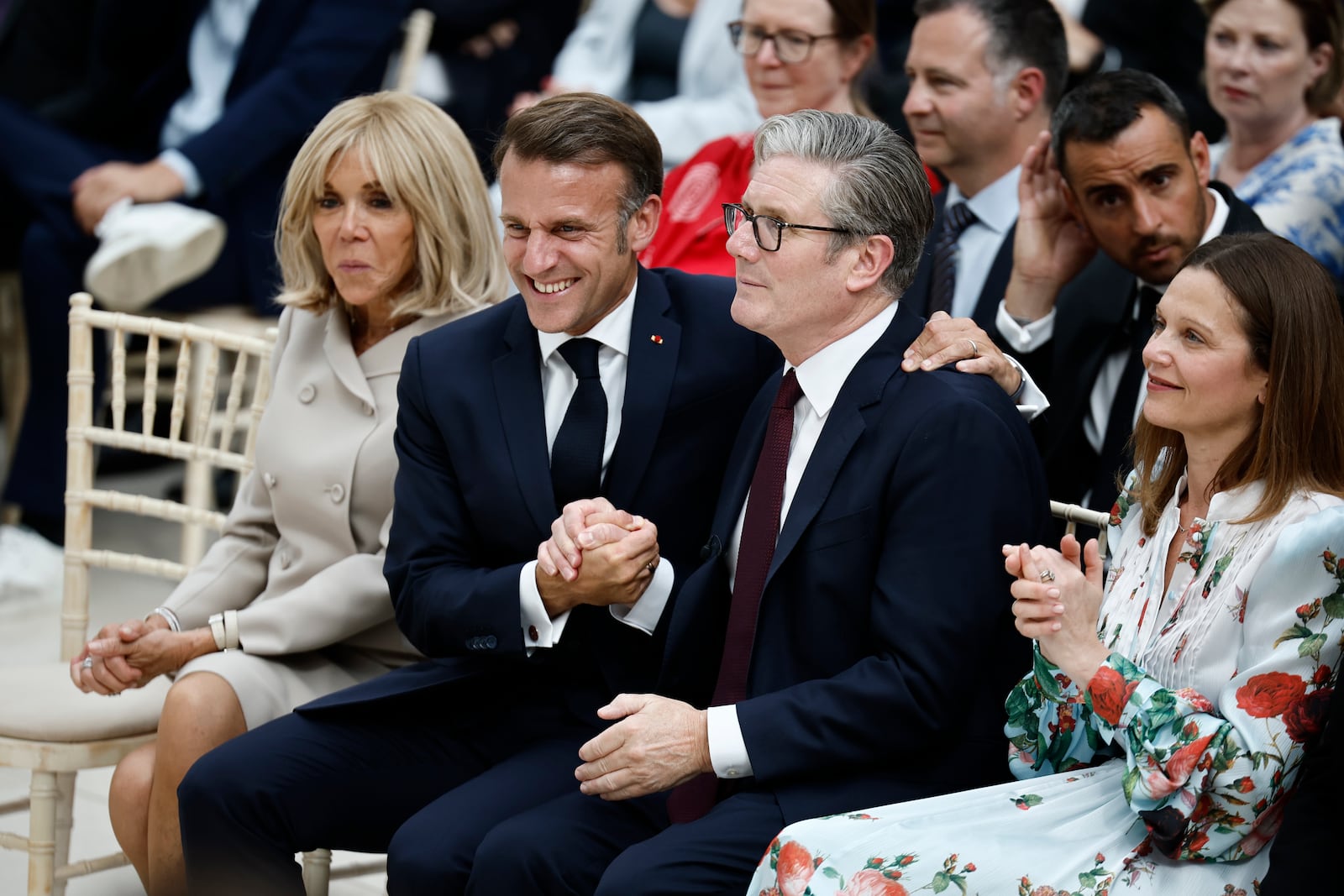 France's President Emmanuel Macron reacts with Britain's Prime Minister Keir Starmer, second right, during a visit to The British Museum in London, Wednesday July 9, 2025. (Benjamin Cremel/Pool Photo via AP)