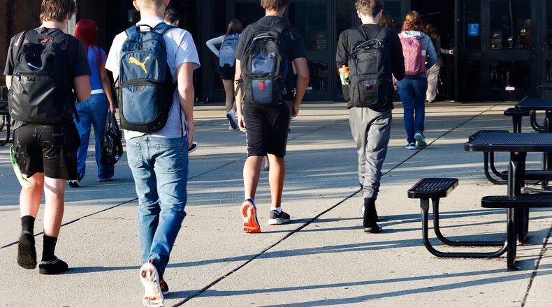 Students arrive Wednesday, Aug. 14, 2024 for the first day of school at Beavercreek High School. MARSHALL GORBY\STAFF