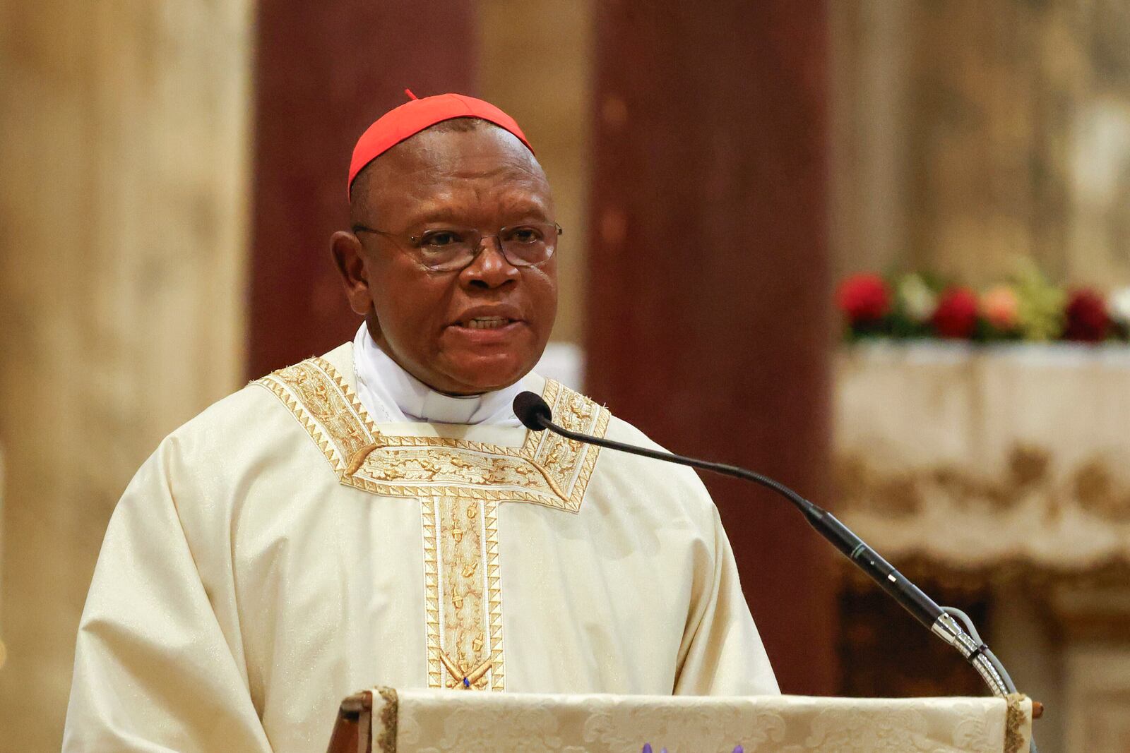 Cardinal Fridolin Ambongo Besungu speaks during a Mass for the beatification of Floribert Bwana Chui Bin Kositi, a Congolese man killed in 2007 for fighting corruption, in St. Paul Outside the Walls' Basilica, in Rome, Sunday, June 15, 2025. (AP Photo/Riccardo De Luca)