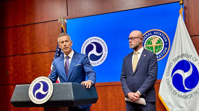 Transportation Secretary Sean Duffy, left, speaks at a news conference with FAA administrator Bryan Bedford to announce flight cancellations across the country because of the government shutdown Wednesday, Nov. 5, 2025 at the U.S. Department of Transportation headquarters in Washington. (AP Photo/Matthew Daly)
