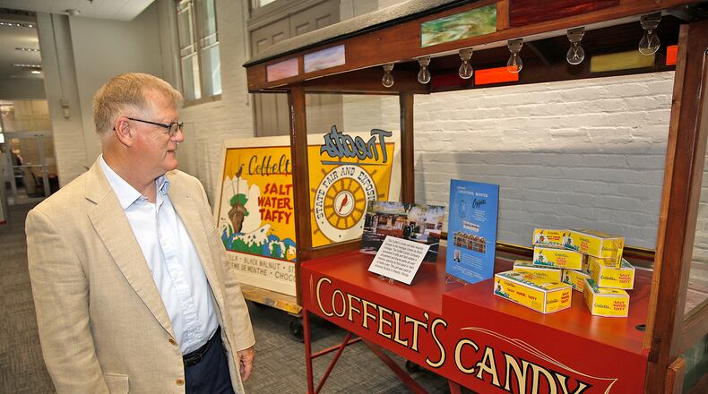 Roger Sherrock, CEO of the Clark County Historical Society, looks over one of the Heritage Museum's recent acquisition, a Coffelt's Candy cart, Wednesday, June 5, 2024. BILL LACKEY/STAFF