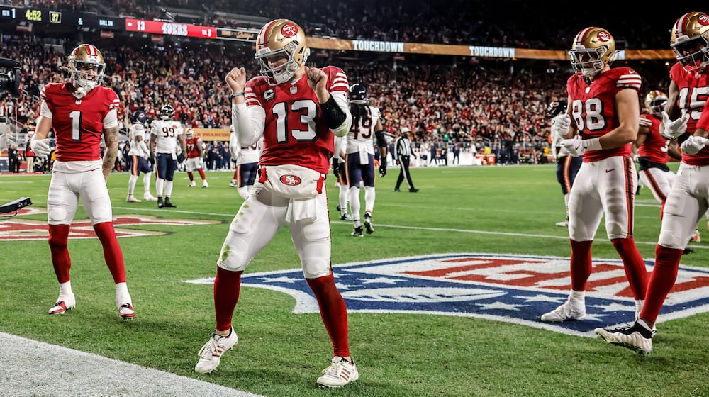 San Francisco 49ers' Brock Purdy (13) dances in the end zone after scoring a touchdown during the first half of an NFL football game against the Chicago Bears in Santa Clara, Calif., Sunday, Dec. 28, 2025. (Carlos Avila Gonzalez/San Francisco Chronicle via AP)