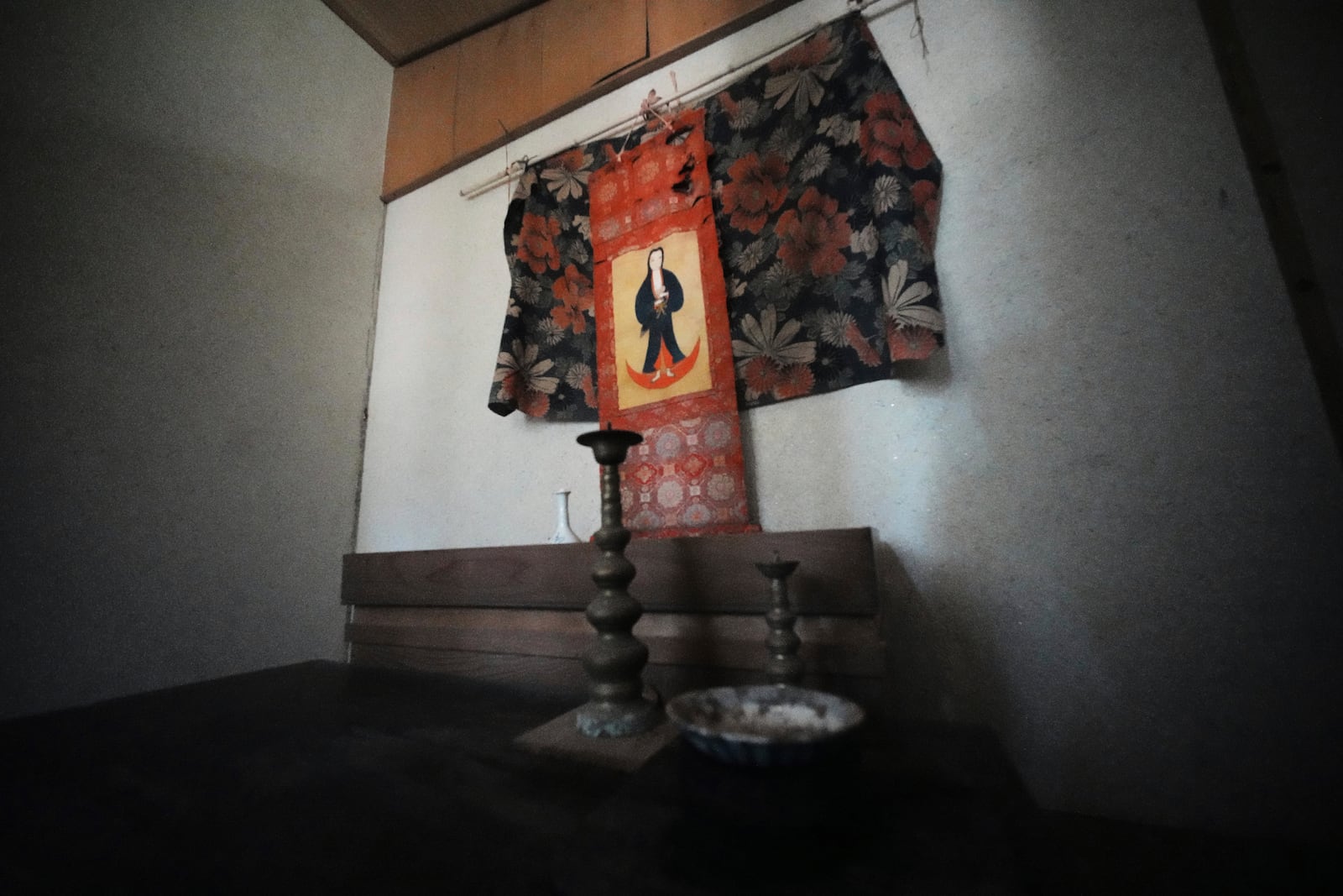 A scroll of the Virgin Mary and Jesus once secretly worshipped hangs at a home in Ikitsuki Island in Hirado, southern Japan, Sunday, April 27, 2025. (AP Photo/Eugene Hoshiko)