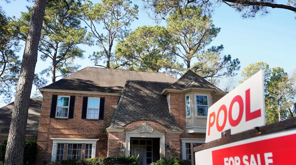 FILE - A real estate sign is shown at a home for sale in Houston, Jan. 13, 2021. (Melissa Phillip/Houston Chronicle via AP, File)