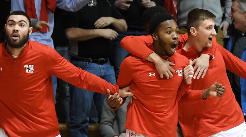 Wittenberg players react to a basket by Jake Bertemes against Wooster on Saturday, Feb. 17, 2018, at Pam Evans Smith Arena in Springfield. Photo by Nick Falzerano