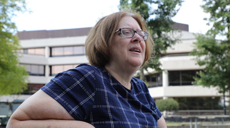 Jerri Jackson, who lost her son in the Aurora, Colorado theater shooting, offers comfort to Dayton and Springfield community after the Oregon District shooting. BILL LACKEY/STAFF