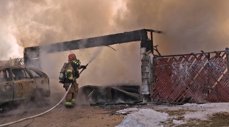 The Springfield Fire Division responded to a fully engulfed detached garage fire on Summit Street this year. The city is currently planning to invest millions in the construction of three new fire stations. BILL LACKEY/STAFF