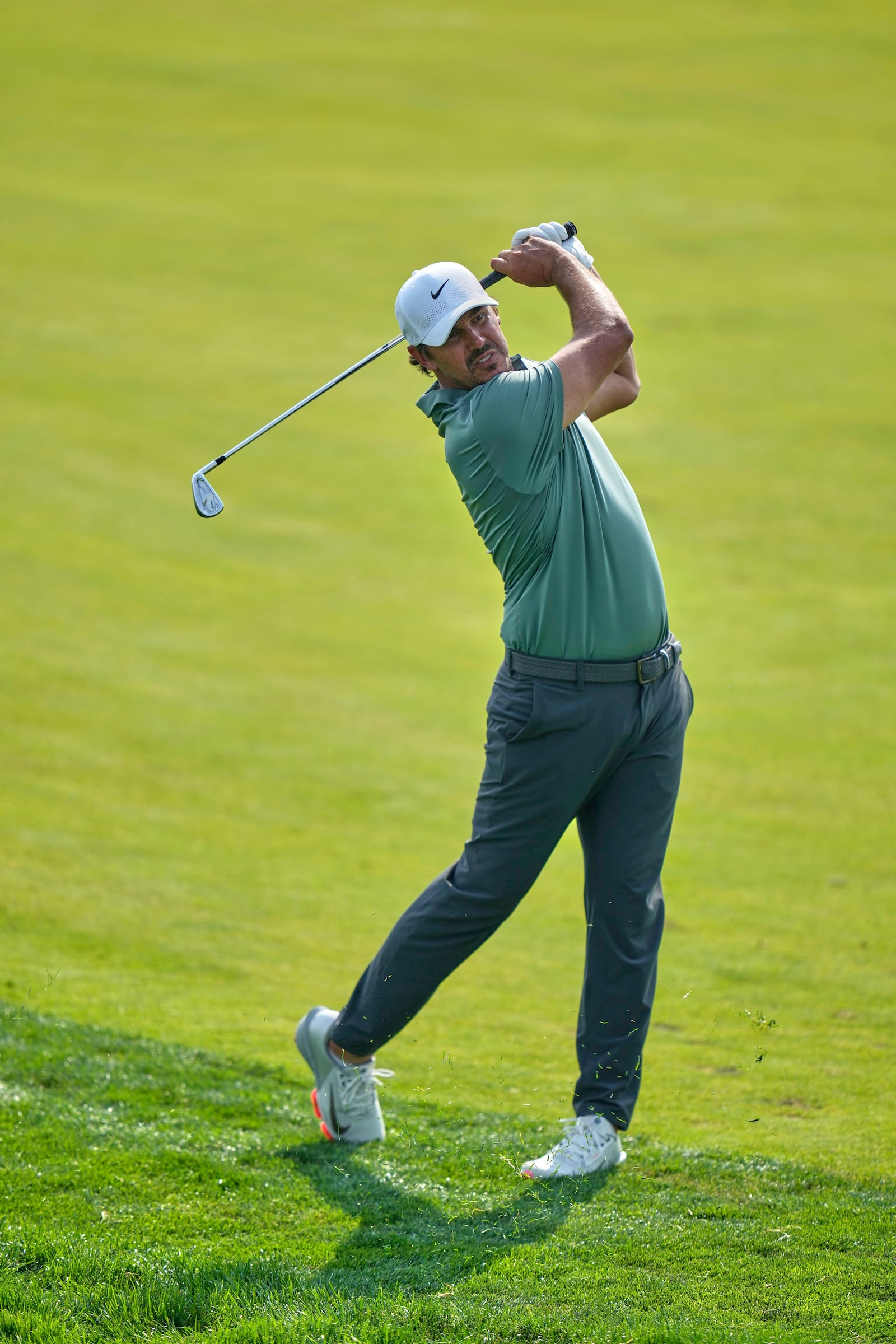 Brooks Koepka hits from the 12th fairway during the first round of the U.S. Open golf tournament at Oakmont Country Club Thursday, June 12, 2025, in Oakmont, Pa. (AP Photo/Seth Wenig)