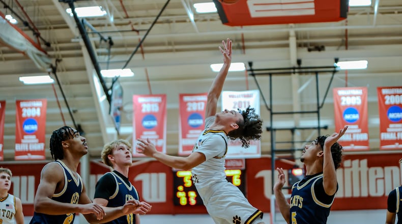 Kenton Ridge High School senior Xavier White shoots the ball in traffic during their game on Monday, Dec. 30 at the Clark County Basketball Showcase at Wittenberg University's Pam Evans Smith Arena. MICHAEL COOPER / STAFF