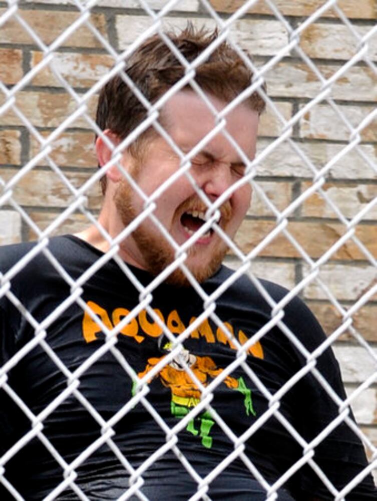 Sun columnist Andy McGinn sits in a dunking tank for charity
