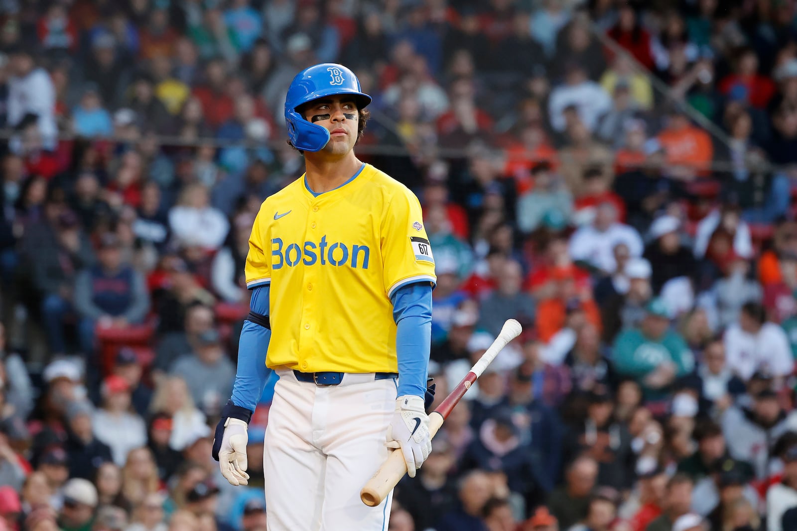 Boston Red Sox third baseman Marcelo Mayer reacts after being called out on strikes in his first major league at bat during the second inning of the second baseball game of a doubleheader against the Baltimore Orioles, Saturday, May 24, 2025, at Fenway Park in Boston. (AP Photo/Mary Schwalm)