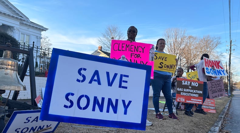 People gather outside the Alabama Governor's Mansion in Montgomery, Ala., on Feb. 16, 2026, to urge Gov. Kay Ivey to grant clemency to Sonny Burton, who is scheduled to be executed on March 12, 2026. (AP Photo/Kim Chandler)
