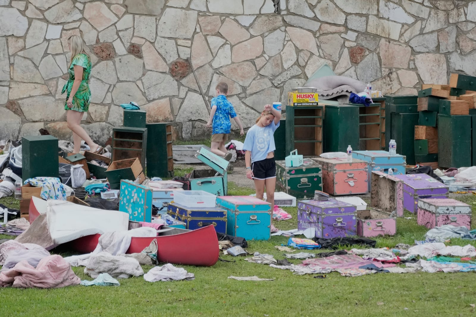 People come to pick up items at Camp Mystic in Hunt, Texas on Wednesday, July 9, 2025. (AP Photo/Ashley Landis)