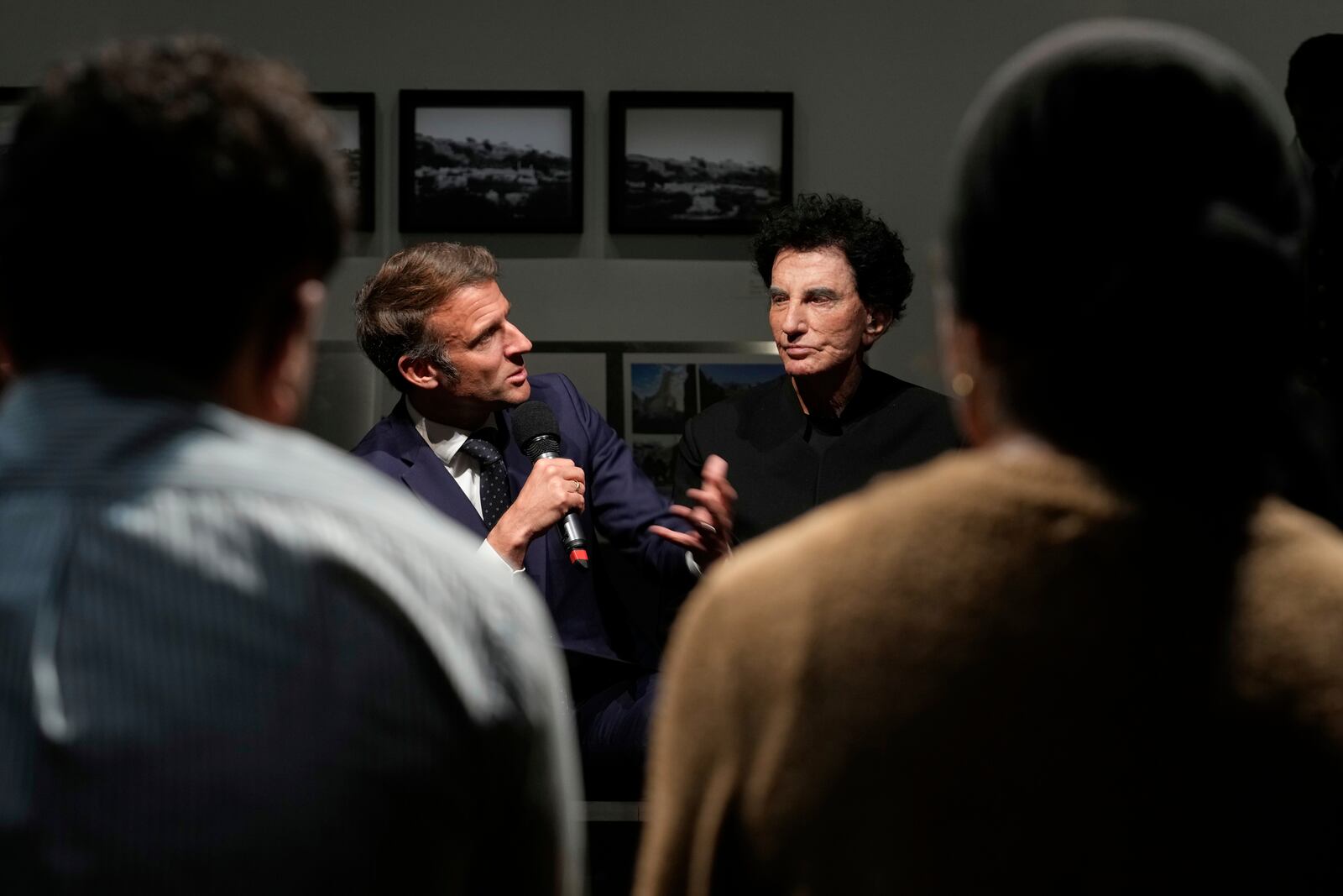 French President Emmanuel Macron, left, speaks as IMA director Jack Lang listens during their visit at the exhibition "Treasures rescued from Gaza" Monday, April 14, 2025 at the Arab World Institute (IMA) in Paris. (AP Photo/Michel Euler, Pool)