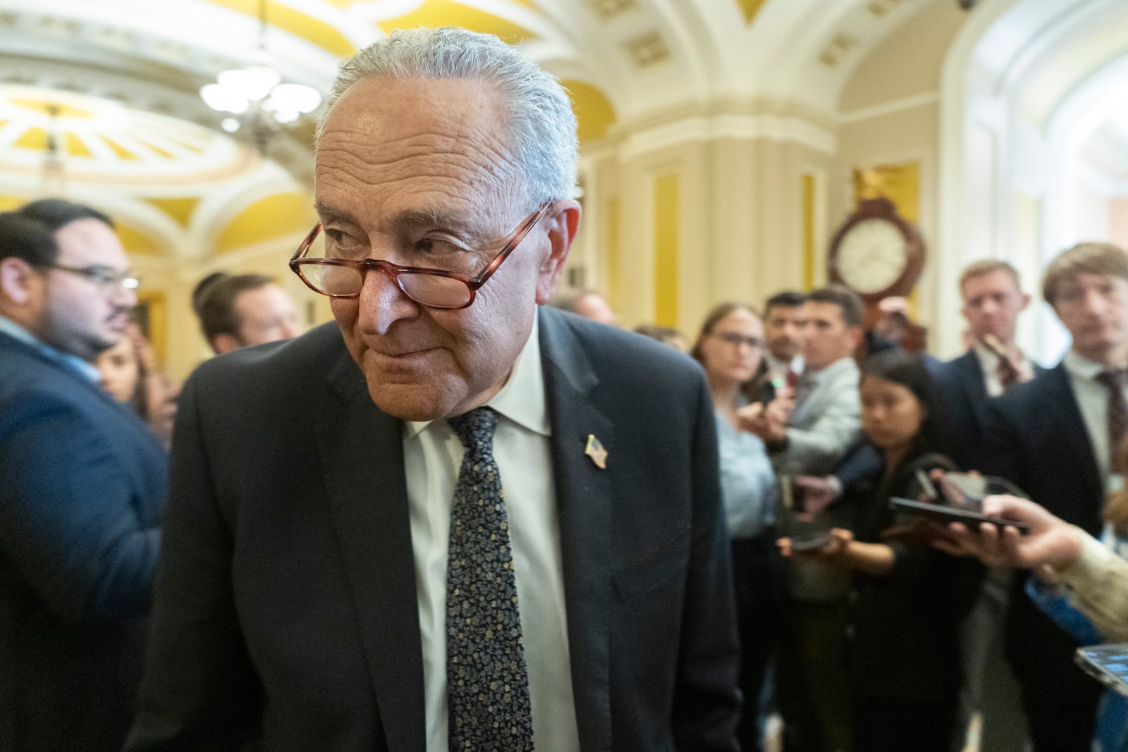 Senate Minority Leader Chuck Schumer, D-N.Y., speaks to reporters outside the Senate chamber as Republicans begin a final push to advance President Donald Trump's tax breaks and spending cuts package, at the Capitol in Washington, Monday, June 30, 2025. (AP Photo/Manuel Balce Ceneta)