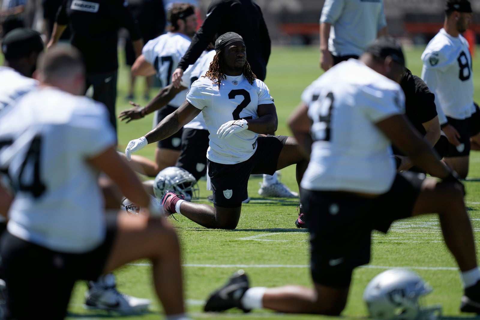 Las Vegas Raiders' Ashton Jeanty warms up during an NFL football rookie mini camp Friday, May 9, 2025, in Henderson, Nev. (AP Photo/John Locher)