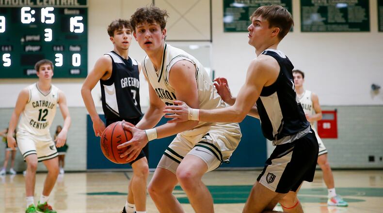 Catholic Central High School's Cole Ray is guarded by Greenon's Clay Hough during their game on Jan. 25 at Jason Collier Gymnasium in Springfield. CONTRIBUTED PHOTO BY MICHAEL COOPER