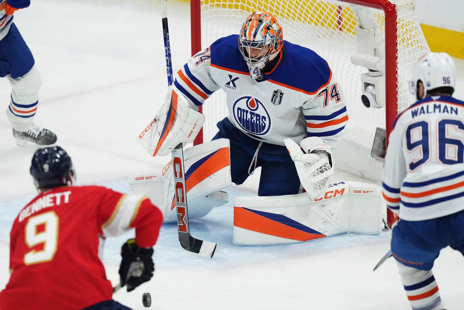 Edmonton Oilers goalie Stuart Skinner (74) stops Florida Panthers' Sam Bennett (9) during the second period in Game 6 of the Stanley Cup final in Sunrise, Fla., on Tuesday, June 17, 2025. (Nathan Denette/The Canadian Press via AP)