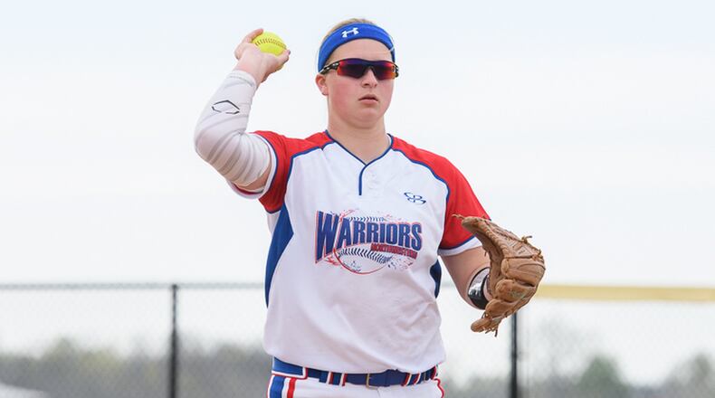 Northwestern junior pitcher Jenna Robbins throws to first base during a Central Buckeye Conference game against Graham on Monday night. Robbins struck out nine batters in the Warriors’ 2-1 victory. Contributed Photo by Bryant Billing