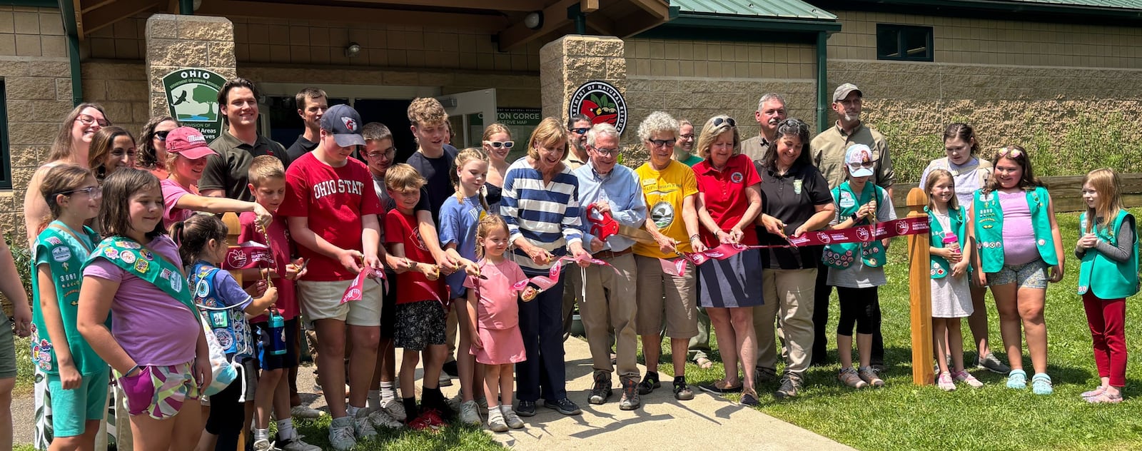 Ohio Gov. Mike DeWine and others cut a ribbon to celebration the opening of the Clifton Gorge Nature Preserve's new Exploration Center Thursday, June 12, 2025. JESSICA OROZCO/STAFF