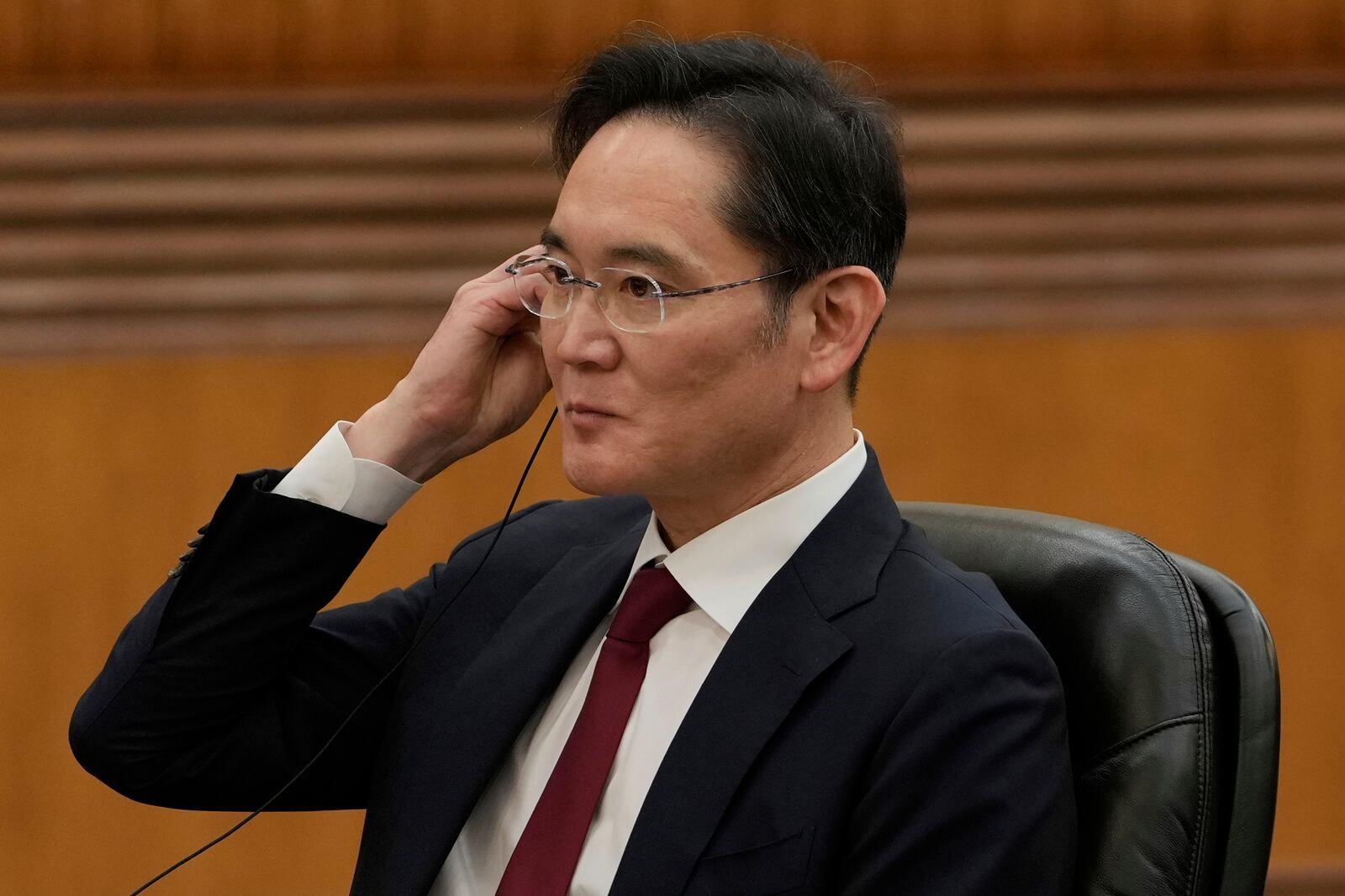 Samsung Electronics Chairman Lee Jae-yong listens as Chinese President Xi Jinping speaks during a meeting with international business representatives at the Great Hall of the People in Beijing on Friday, March 28, 2025. (AP Photo/Ng Han Guan)