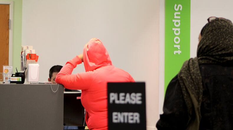 Two women visit the child support section of the newly renovated Job Center. CORNELIUS FROLIK / STAFF